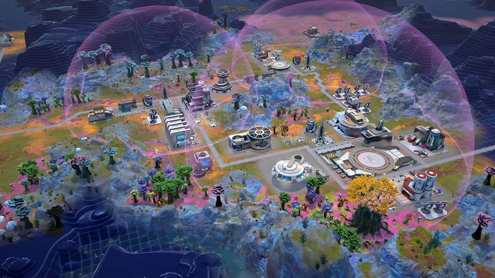 Official gameplay footage of a developed outpost seen from above under a translucent blue dome overlay, with roads, pads and modules spread across the terrain