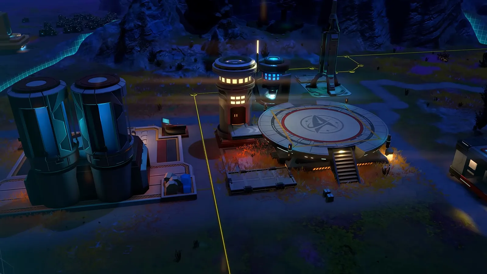 Official gameplay footage of a landing pad and nearby buildings at night with a few lit windows