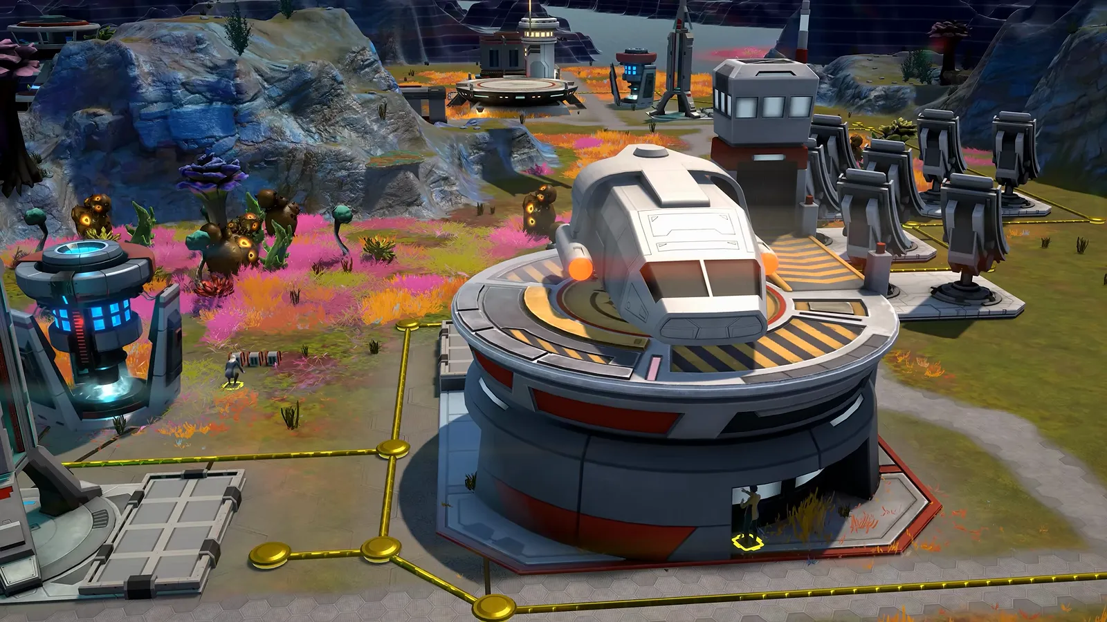 Official gameplay footage of a round, domed building on a circular platform with tall pylons and smaller modules around it