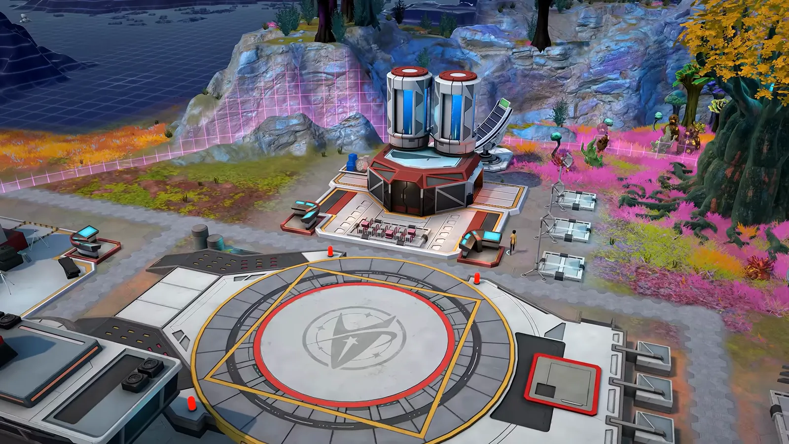 Official gameplay footage of a circular landing pad marked with a Starfleet emblem, with tanks and modules behind it