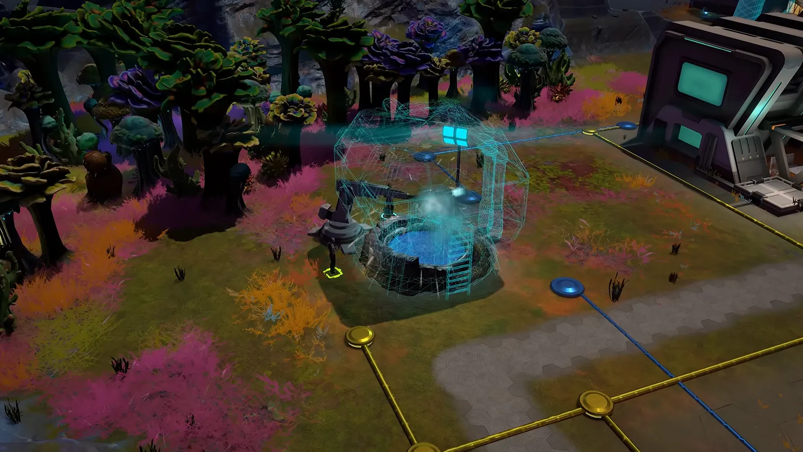 Official gameplay footage of a glowing cyan structure on a paved pad with yellow lines and round junction nodes running across the ground