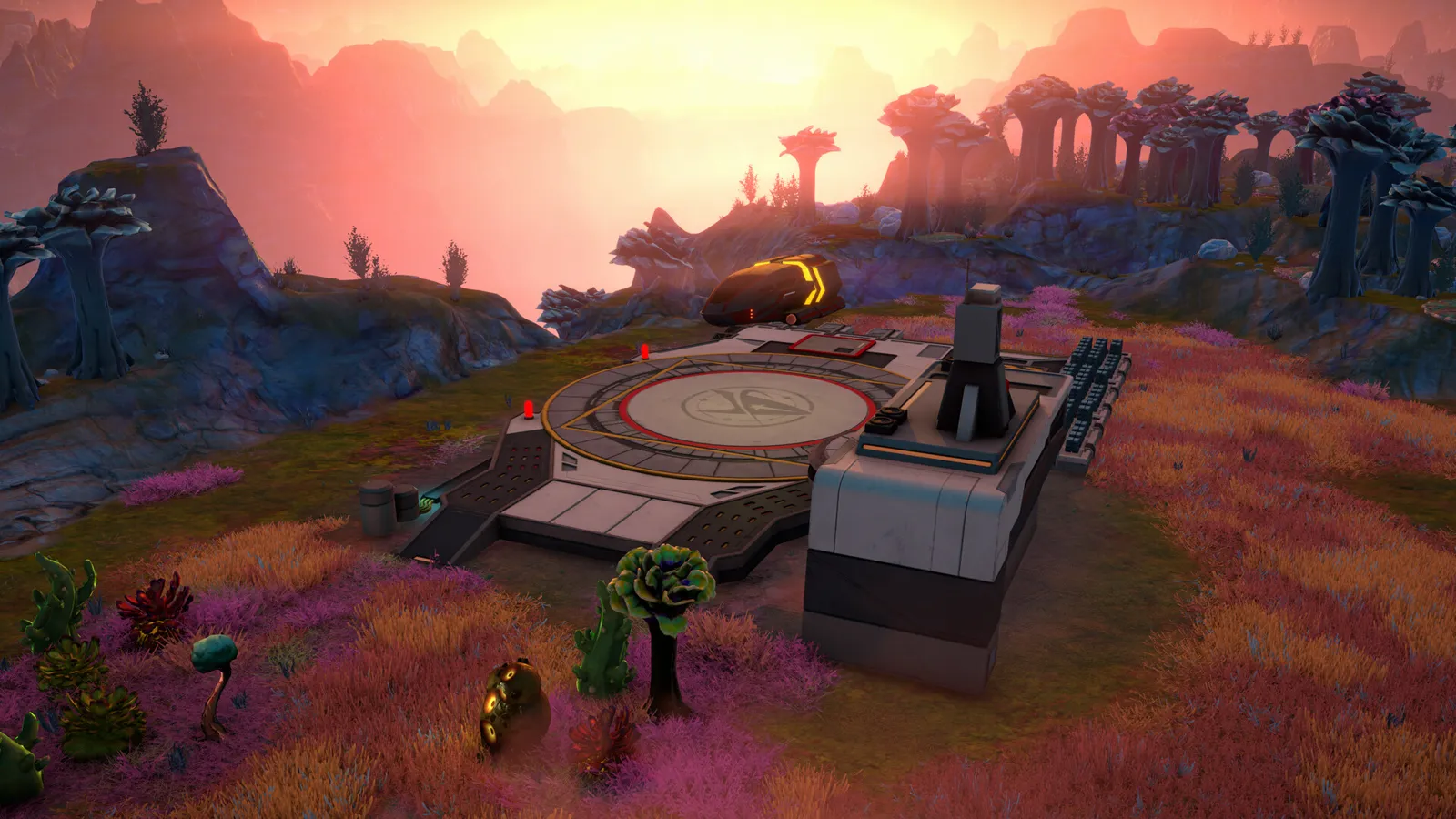 Steam screenshot of a circular landing pad beside a tall grey block with a small tower on a hilltop at sunset, among purple and orange plants